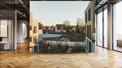 Wide image view from above of modern apartment buildings and construction site in the center of the image modern French architecture in calm neighborhood Wall mural