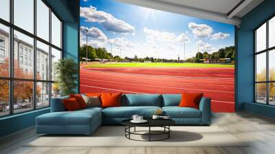 Red running track in stadium Wall mural