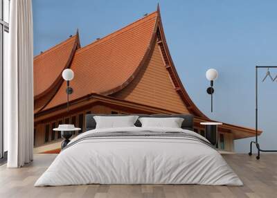 Traditional roof in Thai architecture against blue sky Wall mural