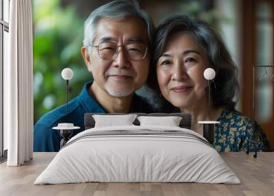 Happy smiling asian mature senior couple posing together Wall mural