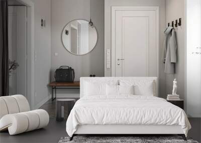 Minimalist modern entrance hall with a white door, gray wooden floor and black metal accessories Wall mural