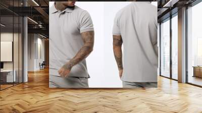 Front and back views of a man wearing a grey tshirt with tattoos, Male model wearing a simple gray ash polo shirt on a White background, front view and back view, top section croppedped, AI Generated Wall mural