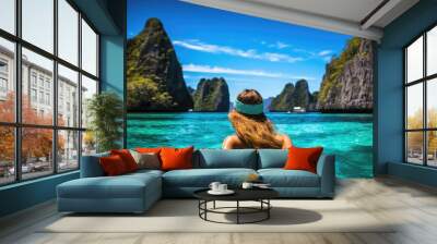 Young woman in turquoise water at Maya bay, Phi Phi island, Thailand, A young woman swimming in clear sea water in a lagoon and looking at a beautiful landscape, AI Generated Wall mural