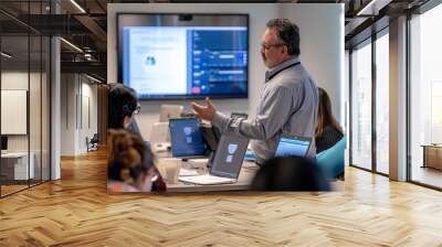 A man standing in front of a classroom full of students, teaching cybersecurity concepts, A cybersecurity specialist training employees on cybersecurity awareness Wall mural