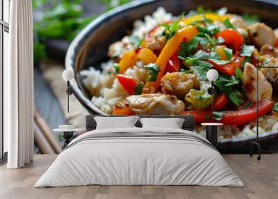 Close-up view of a bowl of food with fluffy jasmine rice, stir-fried with colorful vegetables, A dish of fragrant jasmine rice, stir-fried with colorful bell peppers and tender chunks of chicken Wall mural