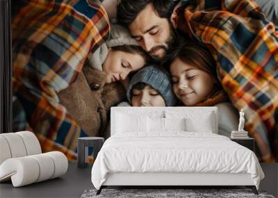 Father and kids nestled closely together, peacefully asleep under a cozy plaid blanket, Family snuggled together under a plaid blanket Wall mural