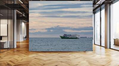 Ship in sea under sky Wall mural