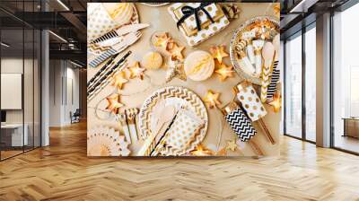 Accessories for children's parties in Gold  color. Flat lay, top view Wall mural