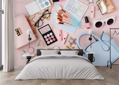 Flat lay of female fashion accessories, makeup products and handbag on pastel color background. Beauty and fashion concept Wall mural