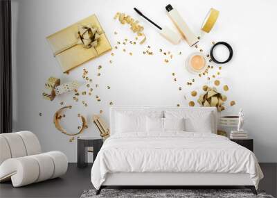 Frame with gift, sequins, makeup cosmetics kit  and other accessories on white background. Composition in gold colors. Flat lay, top view. Wall mural