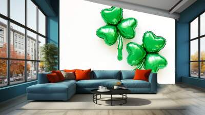 St.Patrick 's Day party decoration. Green balloons of clover leaf shapes. Holiday and celebration concept. Metallic air balloons. Wall mural