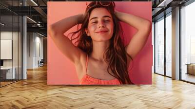 Pretty girl's expression on a color background. A beautiful lifestyle wallpaper. Wall mural