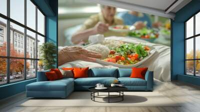 Close up of hospital food being served to an elderly woman in bed Wall mural