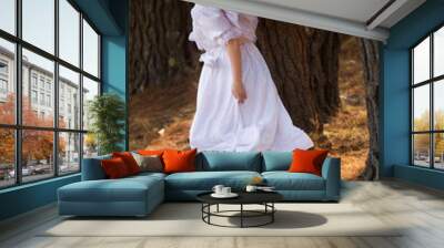 girl in white dress running away Wall mural