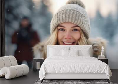 Portrait of a beautiful young woman in a winter hat and scarf Wall mural