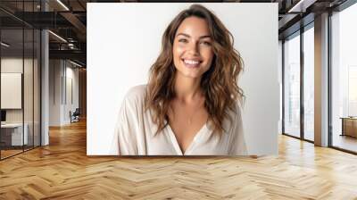 Portrait of a beautiful young woman smiling and looking at camera isolated on a white background Wall mural