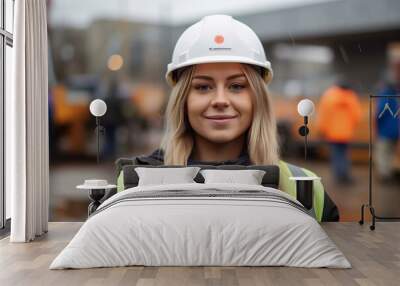 Portrait of a female worker on the background of the construction site Wall mural