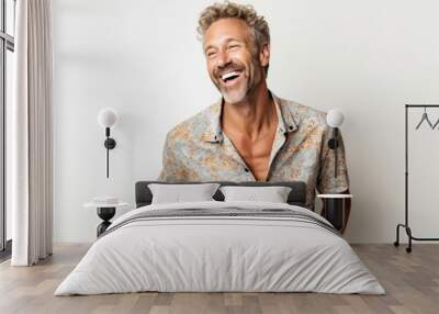 Portrait of a handsome middle aged man laughing on a white background Wall mural