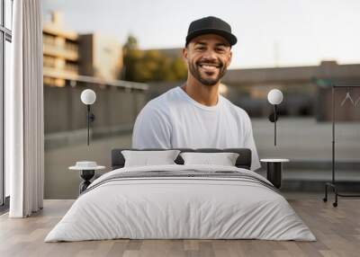 Portrait of a smiling african american man wearing cap outdoors Wall mural