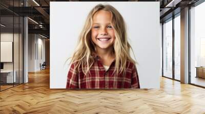 Portrait of a smiling little girl in a checkered shirt Wall mural