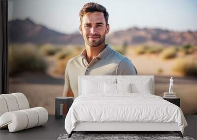 Portrait of handsome man standing in the desert on a sunny day Wall mural