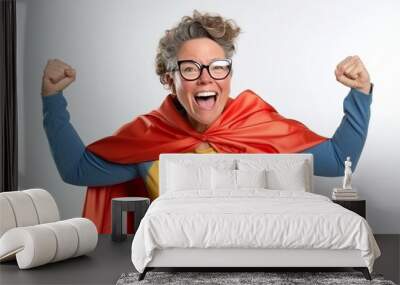 Portrait of happy mature woman in superhero costume on white background. Wall mural