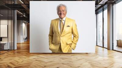 Portrait of senior asian man in yellow suit on white background Wall mural