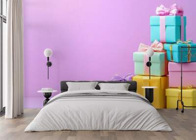   A brightly colored stack of gift boxes is piled high on top of a purple and pink background, adorned with bows and ribbons Wall mural