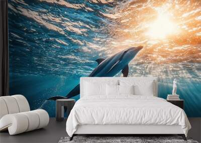   A dolphin swimming in an ocean, illuminated by the sun above its back and with its head raised above the water's surface Wall mural