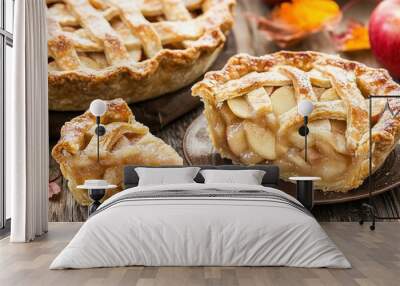   A wooden table holds two pies while a sliced pie rests nearby Wall mural