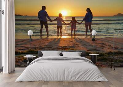  Young family on vacation have a lot of fun at sunset by the sea Wall mural