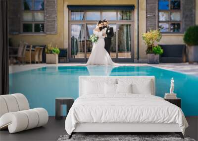 beautiful wedding couple at the pool Wall mural