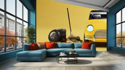 car repair at the service station. replacement of old wheels. yellow car near which the wheel, jack on a yellow background. 3d render. 3d illustration Wall mural