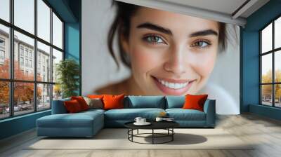 Close-up portrait of smiling young female with bright eyes and f Wall mural