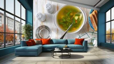 Delicious green bean soup on a white wooden table, top view. Wall mural