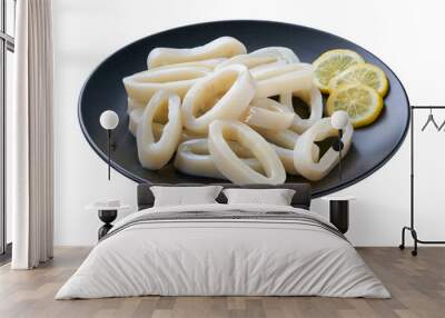 fresh squid rings in a black plate isolated on a white background. Wall mural