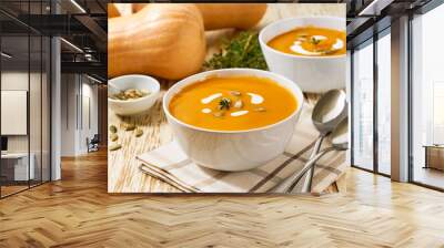 Two bowls of homemade soup with organic butternut squash with pumpkin seeds, selective focus. Wall mural