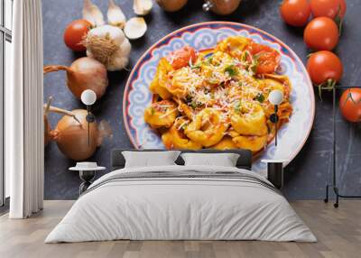 Italian tortellini pasta in tomato sauce Wall mural