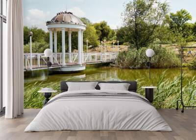 gazebo on the bridge near the pond Wall mural