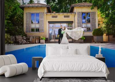 honeymoon - wedding couple at the pool in summer Wall mural