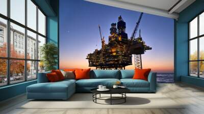 Offshore oil and gas platform in the sea at sunset. Jack up rig crude oil production in ocean. Wall mural