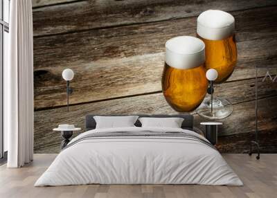 Two glass beer on wood background with copyspace Wall mural