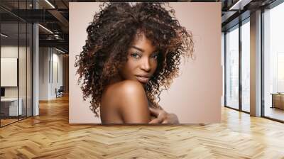  Beautiful black woman . Beauty portrait of african american woman with clean healthy skin on white background. Smiling beautiful afro girl.Curly black hair Wall mural