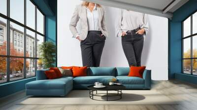  Two Beautiful young business women in different business outfits on white background Wall mural