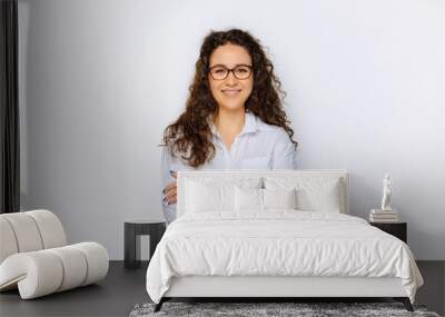 Happy young business woman posing isolated over grey wall background. Wall mural