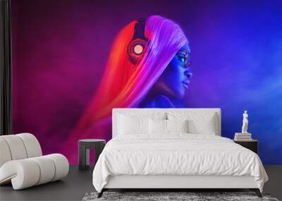 Portrait of fashion young girl in sunglasses in red and blue neon light in the studio Wall mural