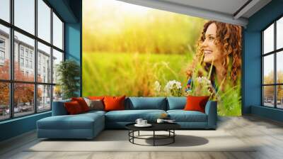 Pretty smiling girl relaxing outdoor Wall mural