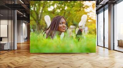 Pretty smiling young girl relaxing outdoor Wall mural