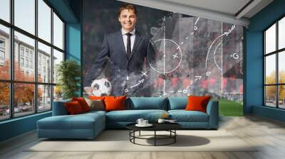 smiling businessman in formal wear with soccer ball in the big stage Wall mural