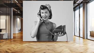 Beautiful woman  with vintage phone. Wall mural